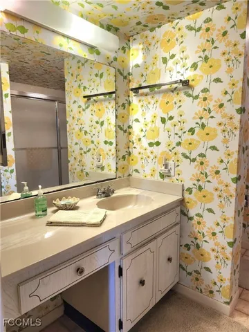 a bathroom with a sink and a mirror