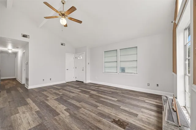 a view of empty room with ceiling fan