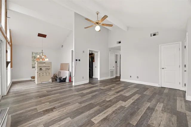a view of a livingroom with a hardwood floor and a ceiling fan