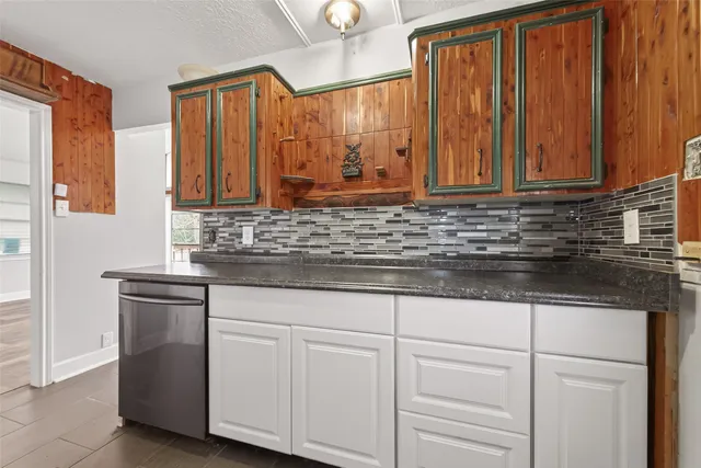a bathroom with a sink and cabinets