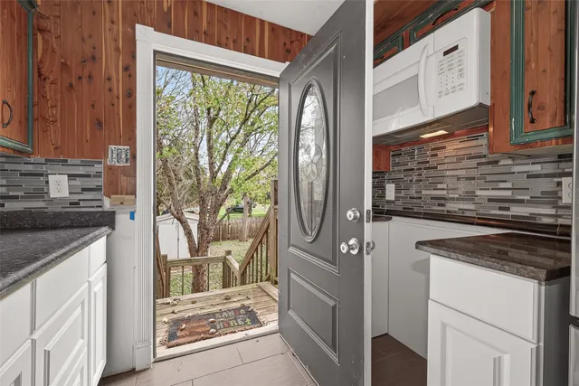 a kitchen with a stove microwave and refrigerator