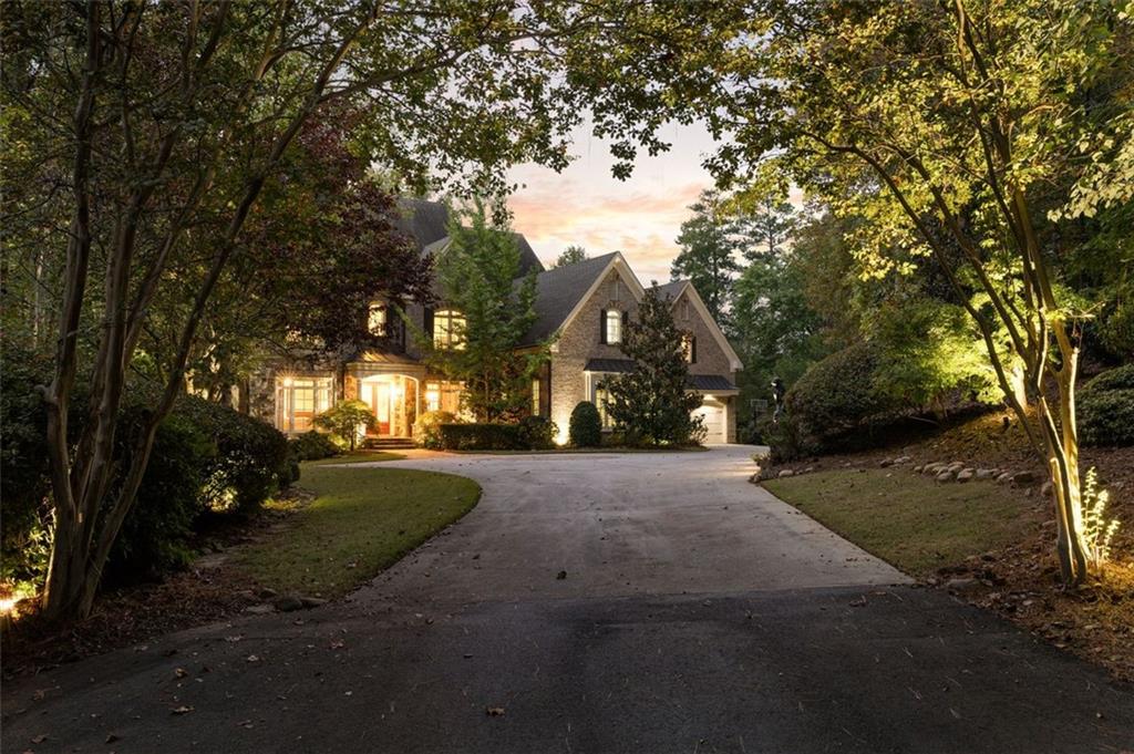 11015 Stroup Road Roswell, GA 30075 - Photo 110 of 113 a view of a street with a yard and a large tree