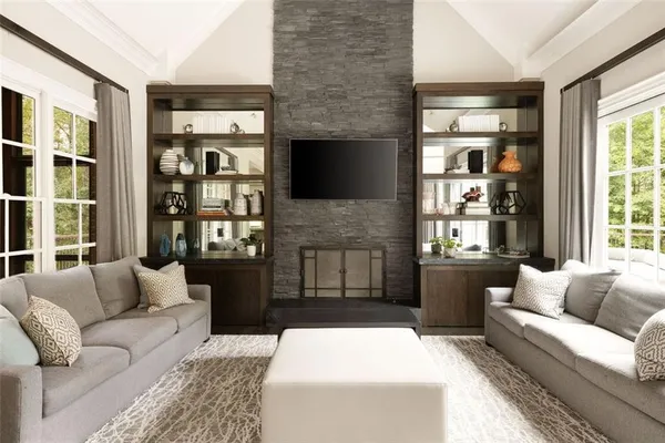 a view of a livingroom with workspace and a window