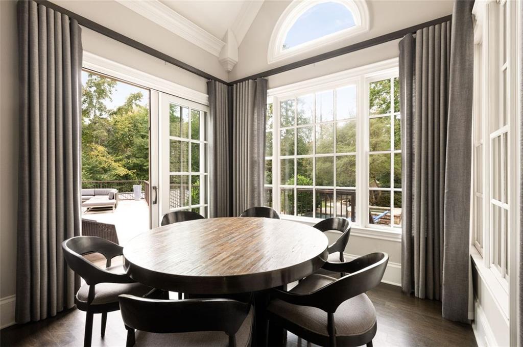 11015 Stroup Road Roswell, GA 30075 - Photo 27 of 113 a view of a dining room with furniture window and wooden floor