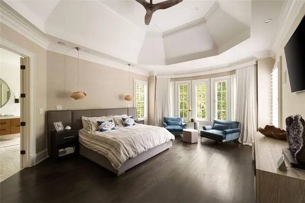 a bedroom with bed and window