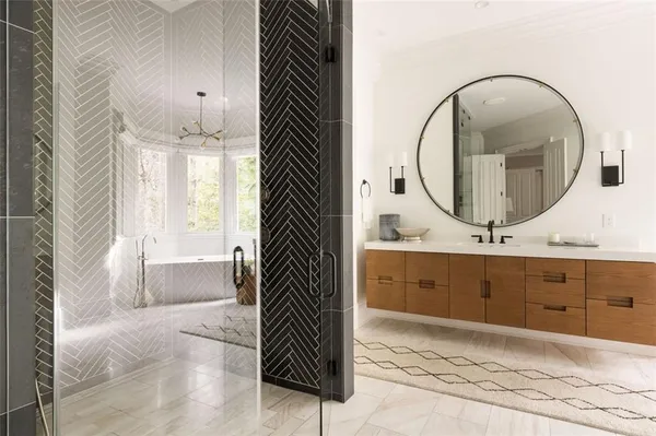 a bathroom with a toilet a sink and mirror