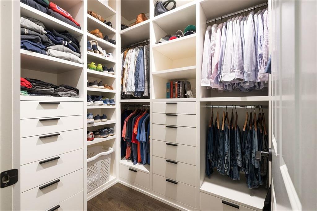 11015 Stroup Road Roswell, GA 30075 - Photo 42 of 113 a view of walk in closet with clothes and shoes