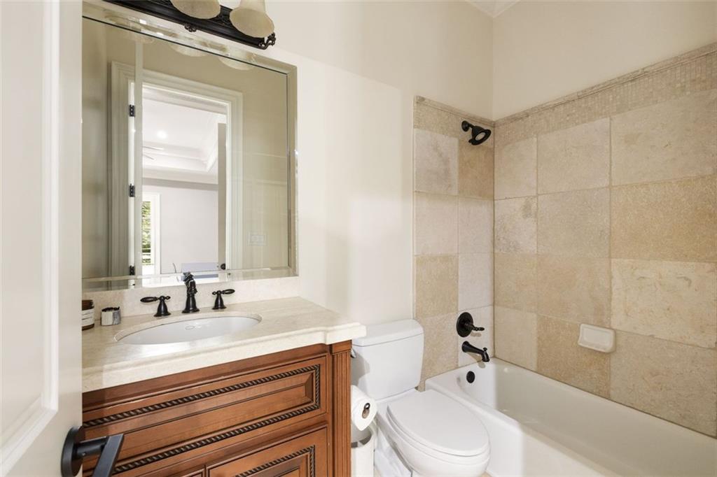 11015 Stroup Road Roswell, GA 30075 - Photo 44 of 113 a bathroom with a sink a toilet and shower