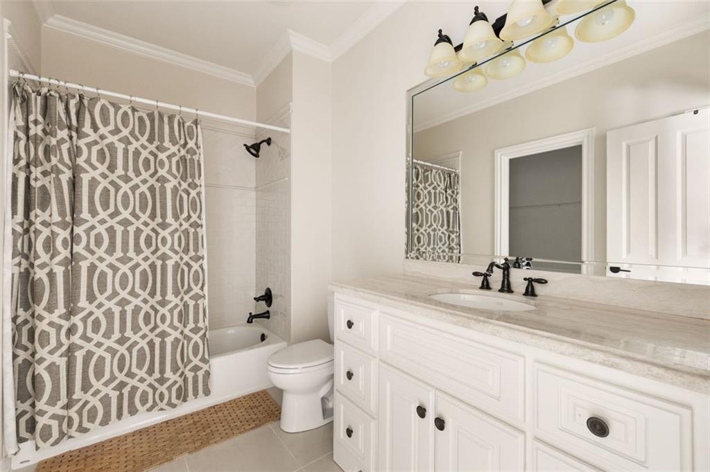11015 Stroup Road Roswell, GA 30075 - Photo 52 of 113 a bathroom with a double vanity sink toilet and shower