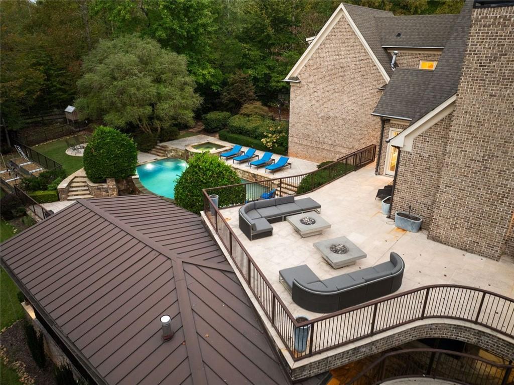 11015 Stroup Road Roswell, GA 30075 - Photo 84 of 113 a view of a patio with table and chairs with wooden floor and fence