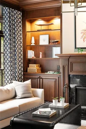 a living room with fireplace furniture and a flat screen tv