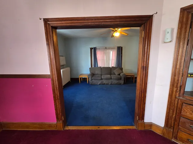 a view of living room with furniture and a window
