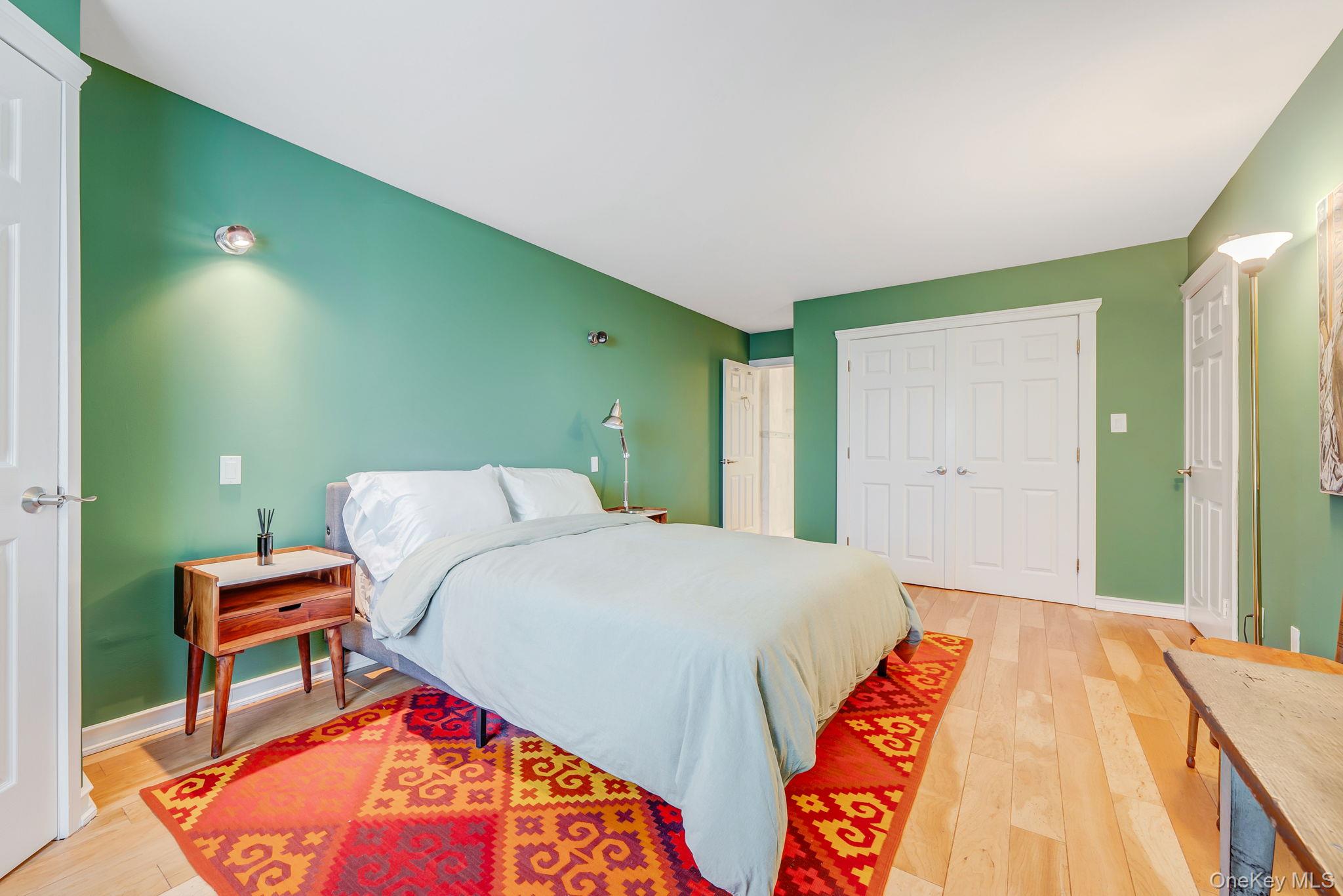 360 Shore Road, Unit 3H Long Beach, NY 11561 - Photo 20 of 23 a bed room with a bed and a chair