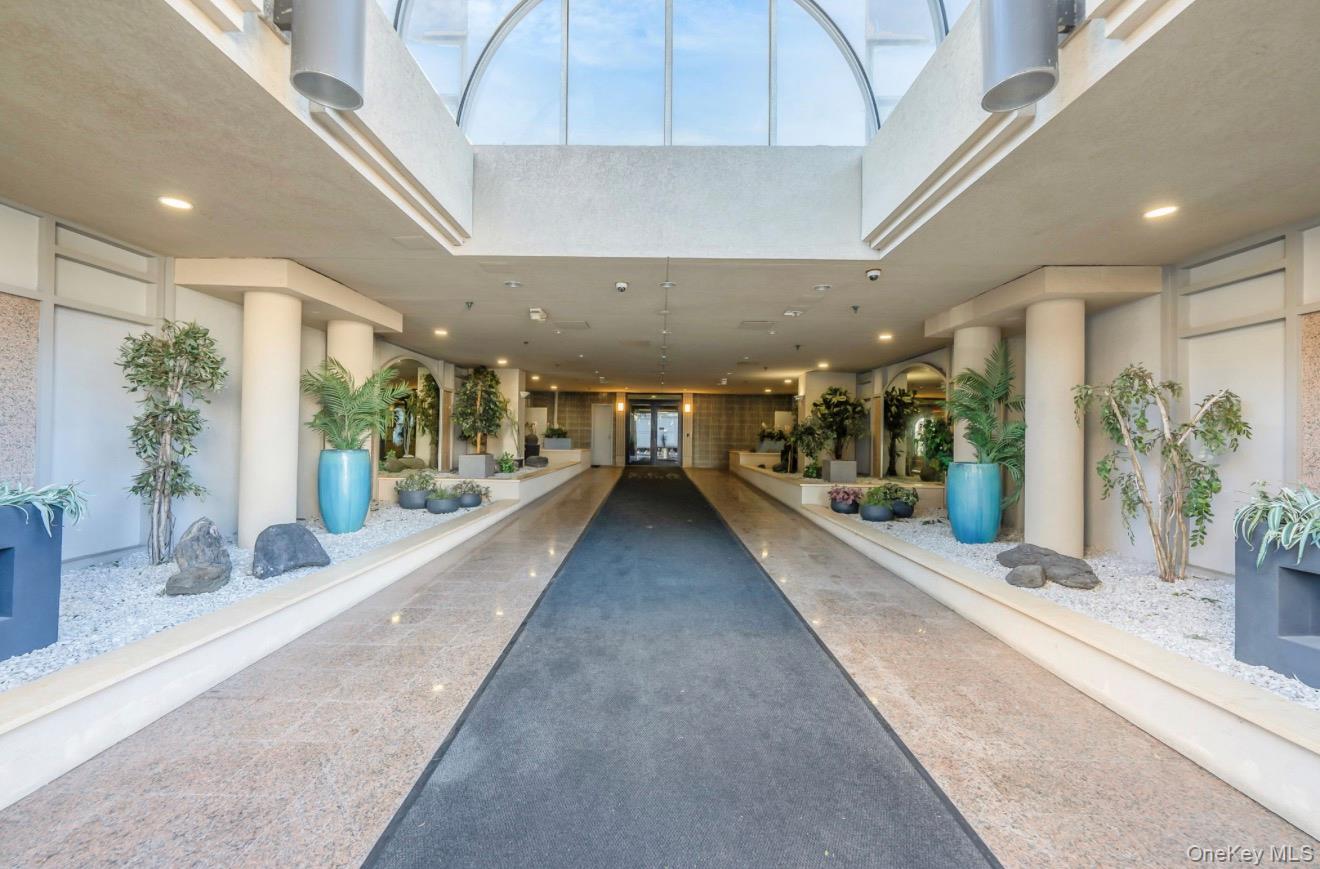 360 Shore Road, Unit 3H Long Beach, NY 11561 - Photo 3 of 23 a view of a lobby with black carpet