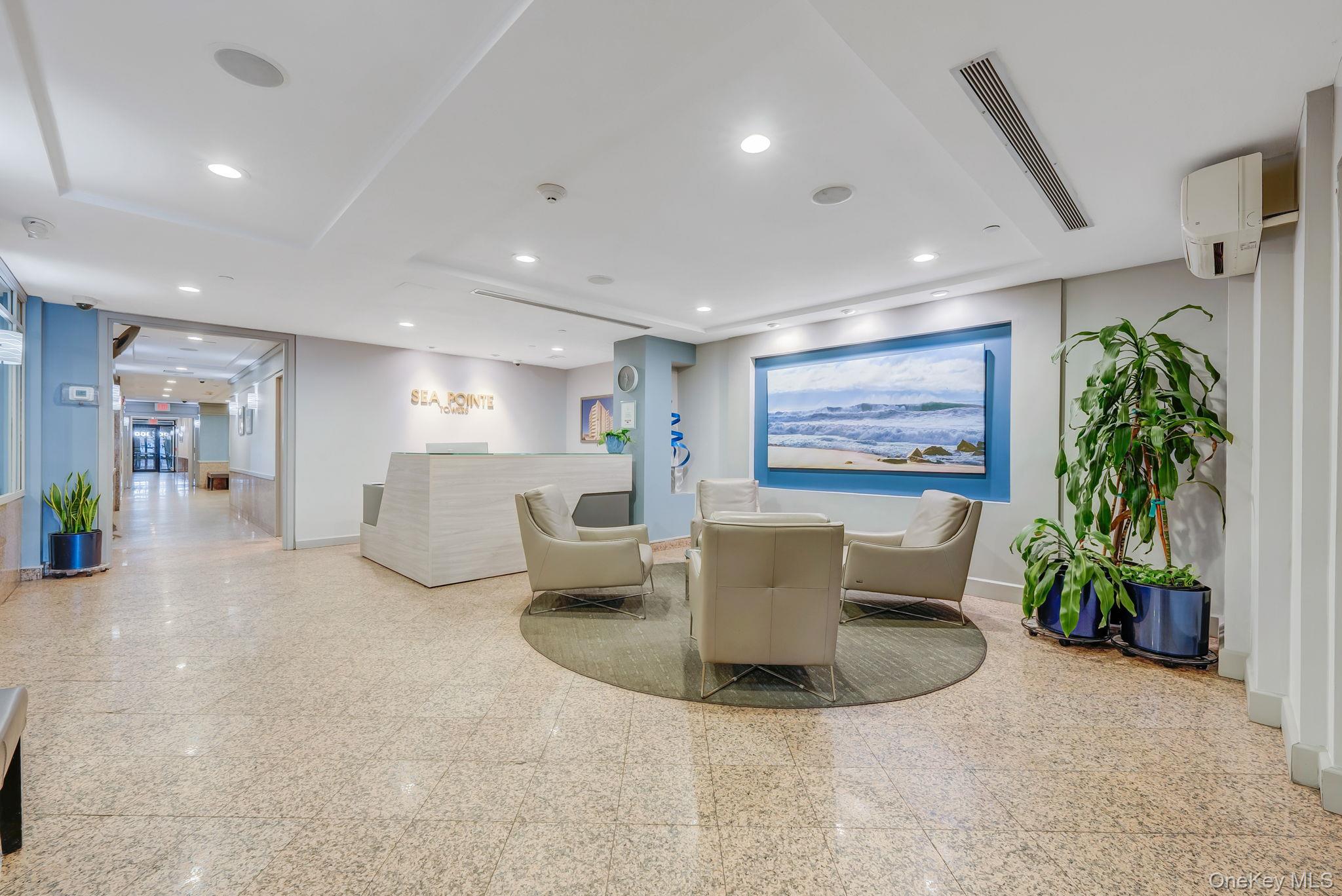 360 Shore Road, Unit 3H Long Beach, NY 11561 - Photo 8 of 23 a living room with furniture a potted plant and a large window