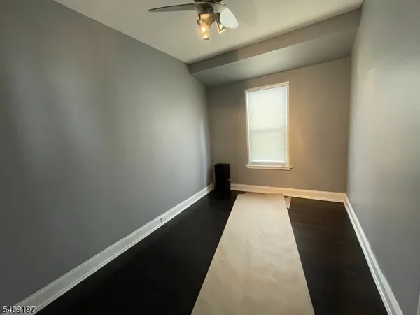 a view of a hallway with a chandelier