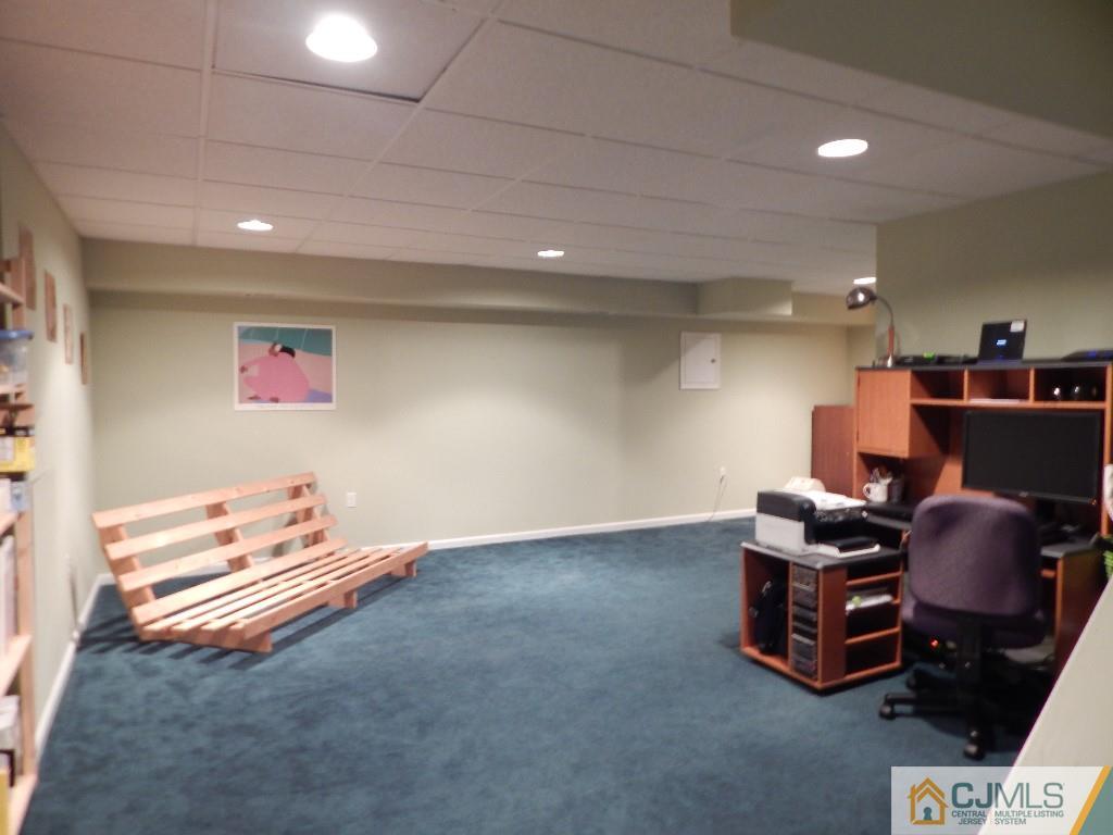 203 Timber Oaks Road Edison, NJ 08820 - Photo 14 of 16 a room with furniture and air hockey table