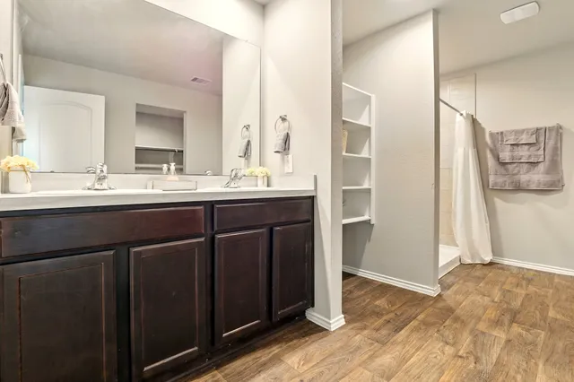 a kitchen with a sink and refrigerator