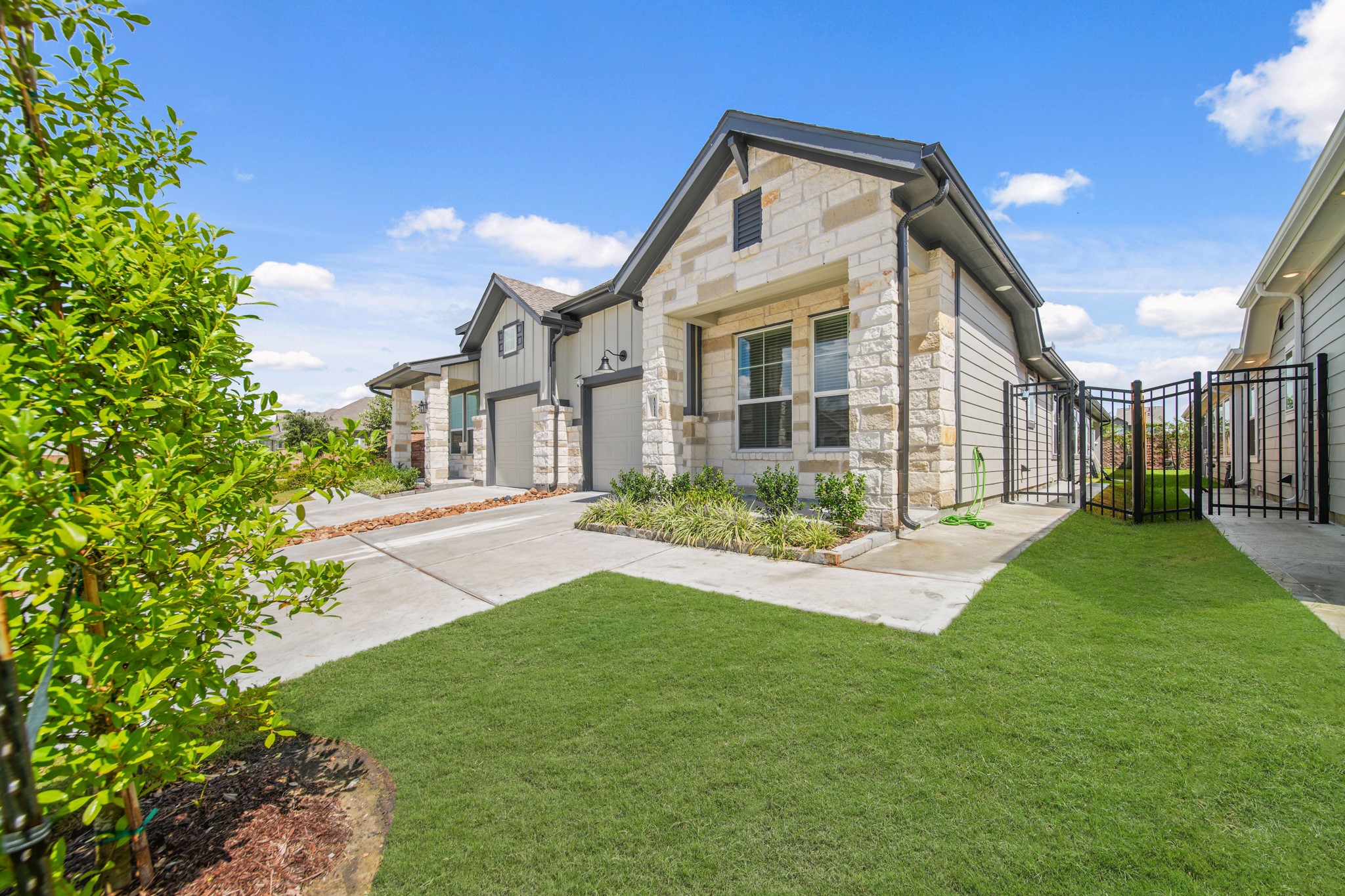 10111 Crescendo Way Manvel, TX 77578 - Photo 1 of 25 a front view of a house with a yard