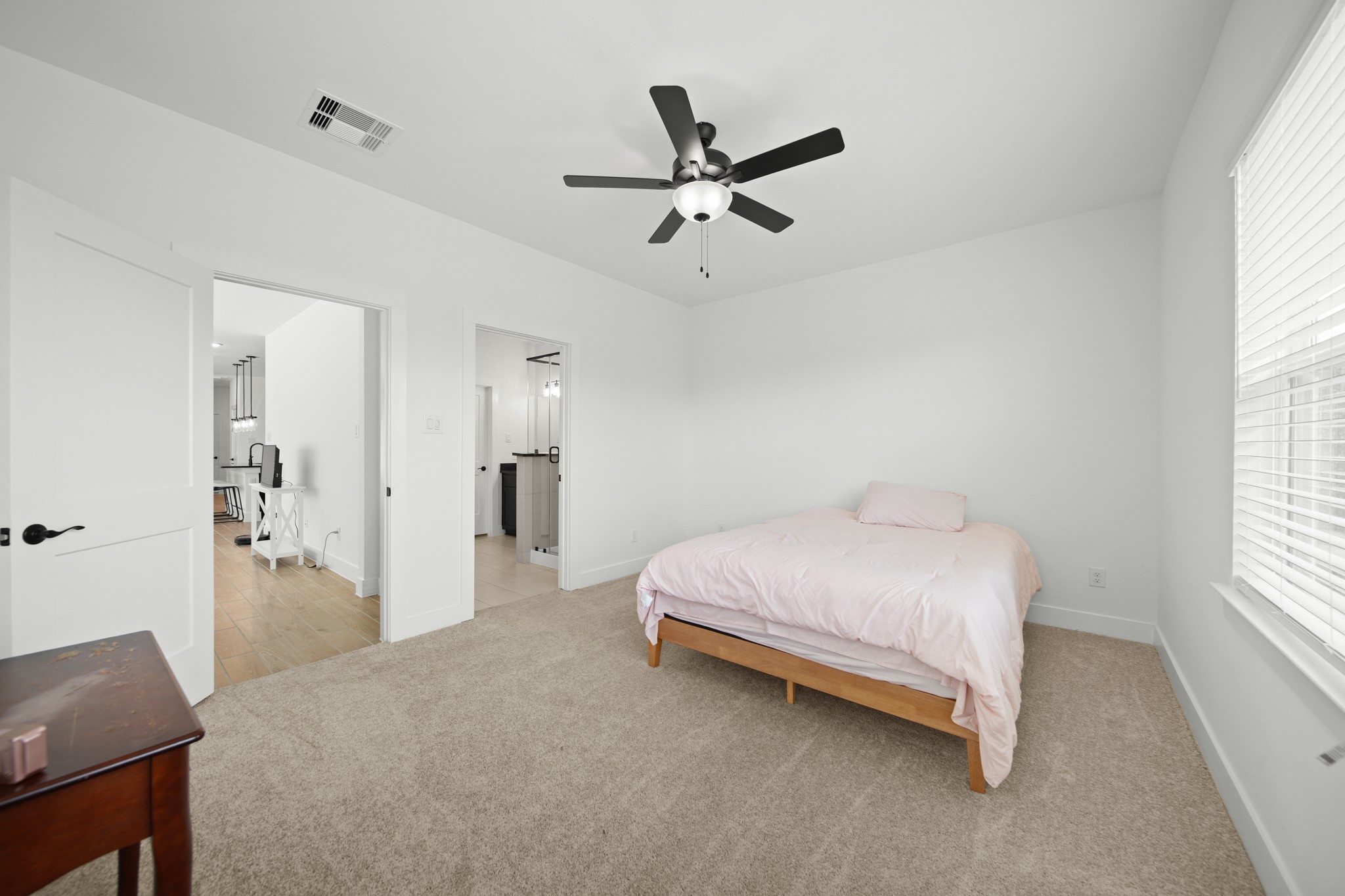 10111 Crescendo Way Manvel, TX 77578 - Photo 13 of 25 a bedroom with a bed and a window