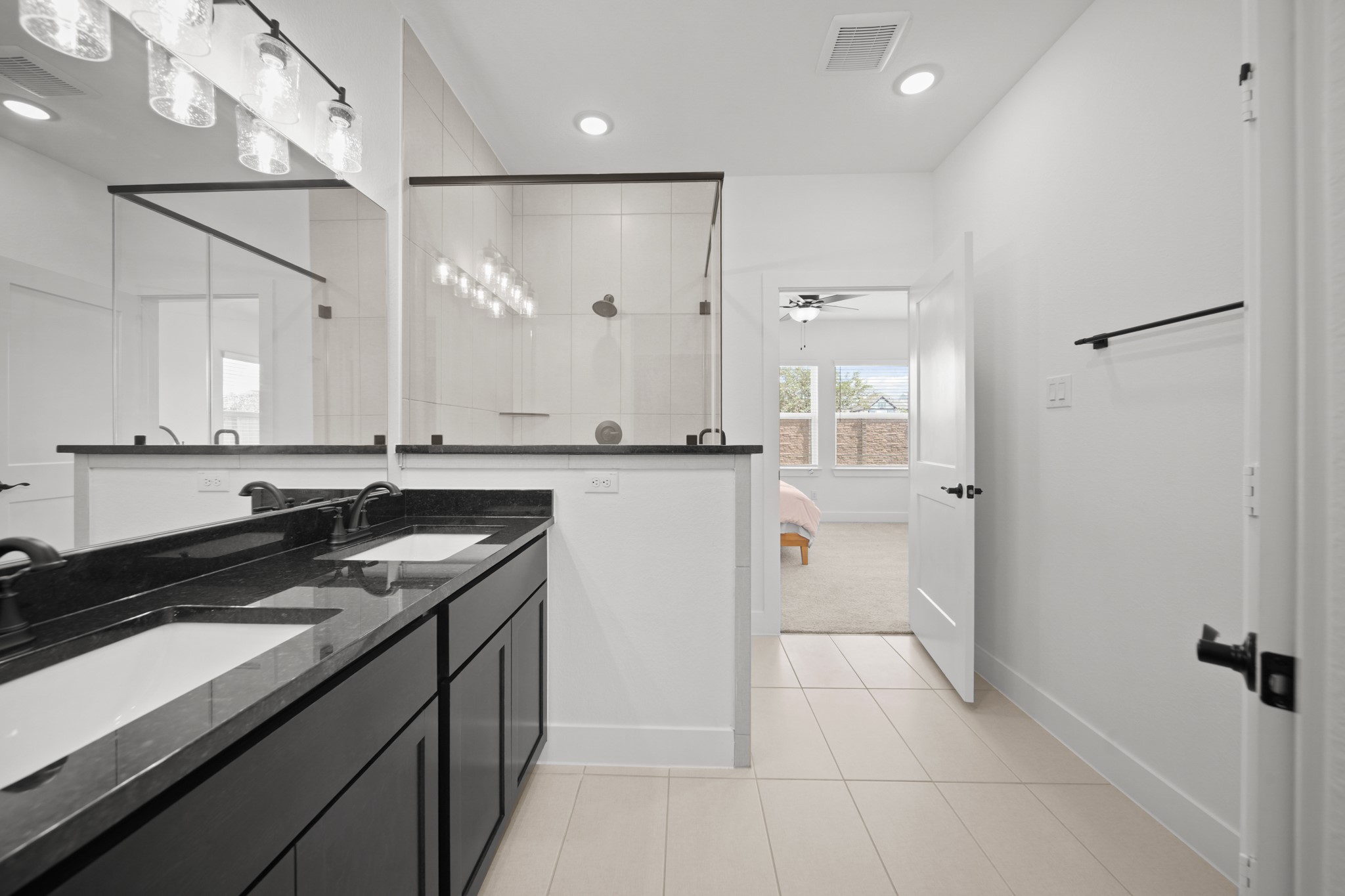 10111 Crescendo Way Manvel, TX 77578 - Photo 14 of 25 a kitchen with a sink refrigerator and cabinets