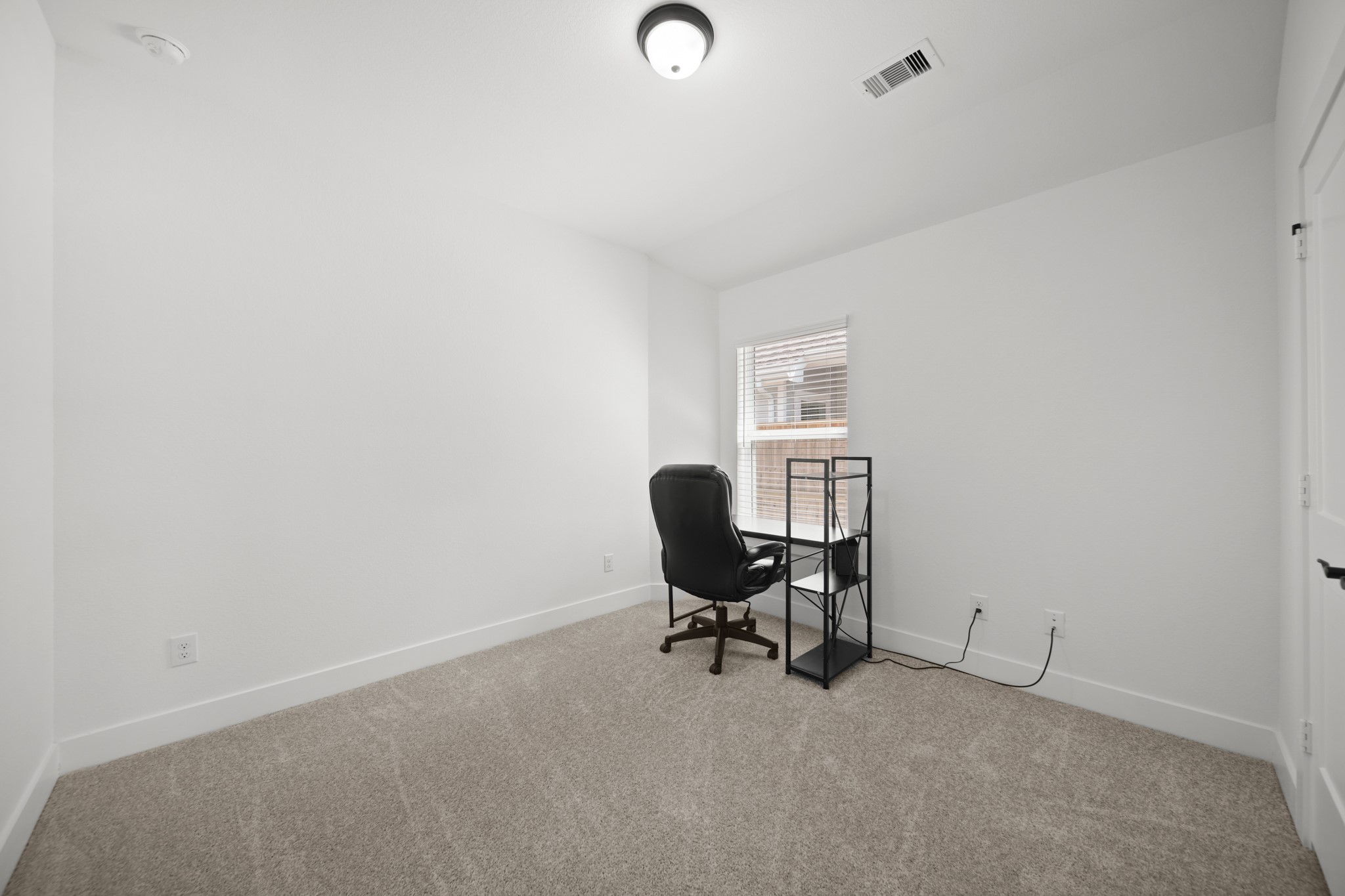 10111 Crescendo Way Manvel, TX 77578 - Photo 17 of 25 a workspace with furniture and a window