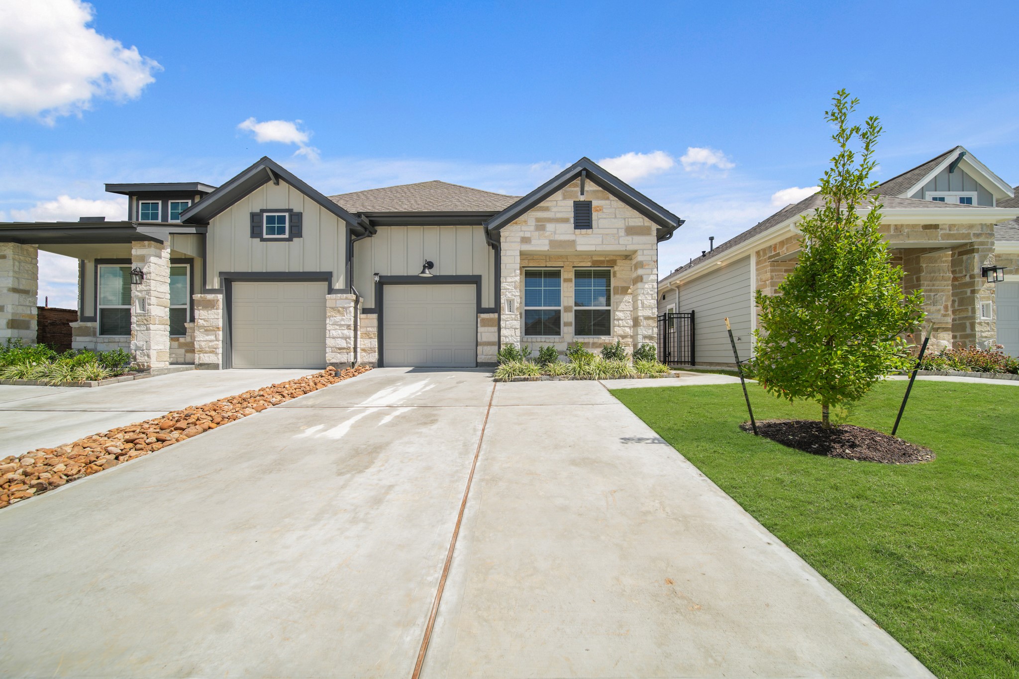 10111 Crescendo Way Manvel, TX 77578 - Photo 2 of 25 a front view of a house with a yard and garage