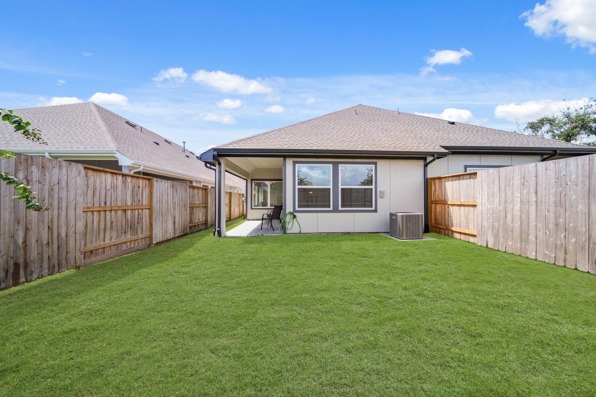 10111 Crescendo Way Manvel, TX 77578 - Photo 24 of 25 a view of a house with a garden