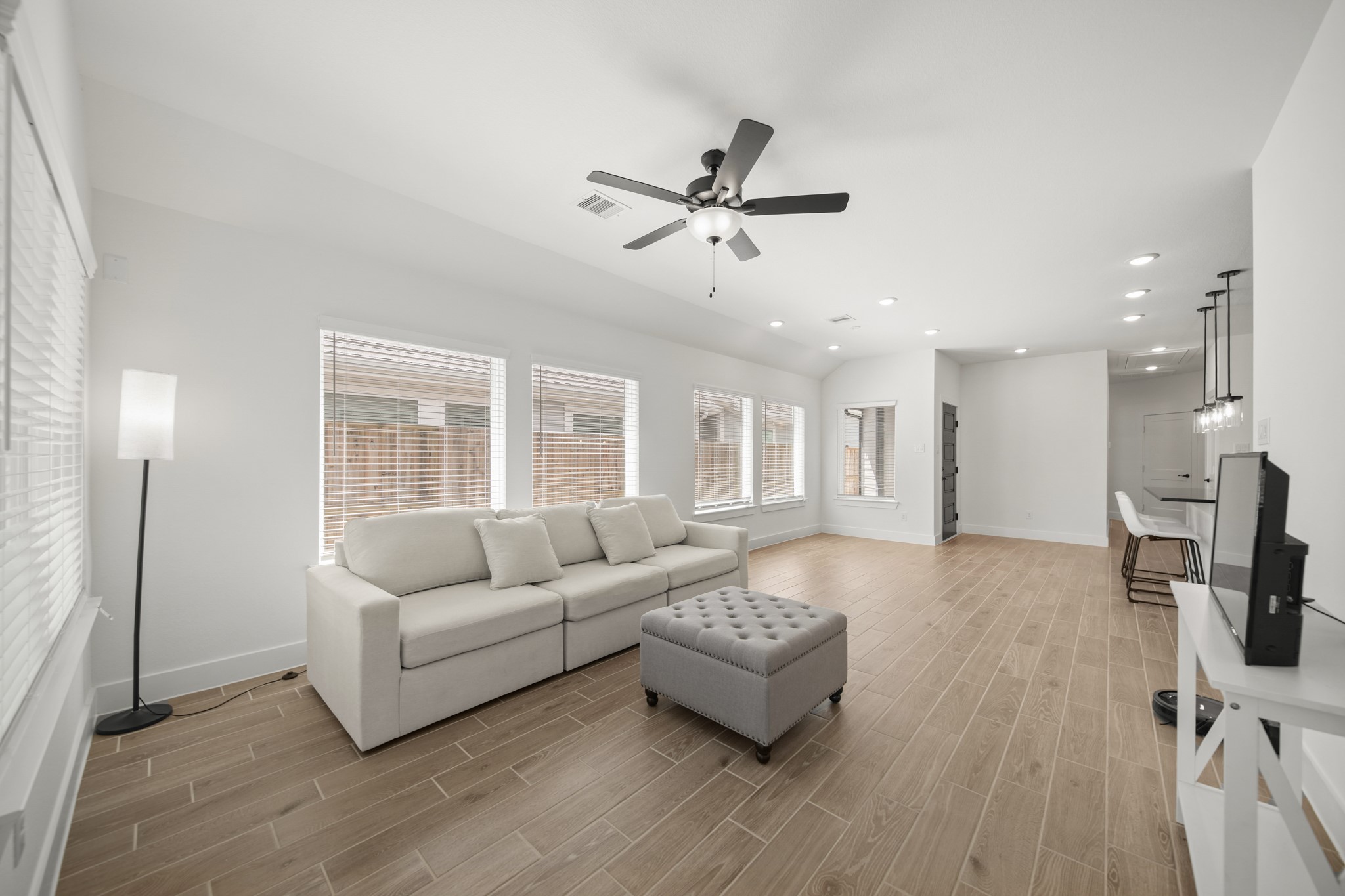 10111 Crescendo Way Manvel, TX 77578 - Photo 9 of 25 a living room with furniture and a wooden floor