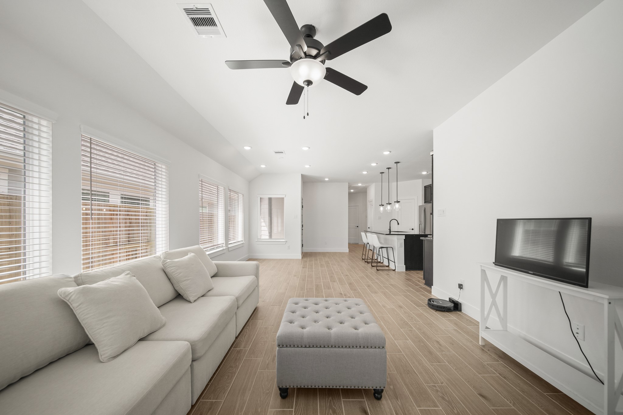 10111 Crescendo Way Manvel, TX 77578 - Photo 10 of 25 a living room with furniture and a flat screen tv