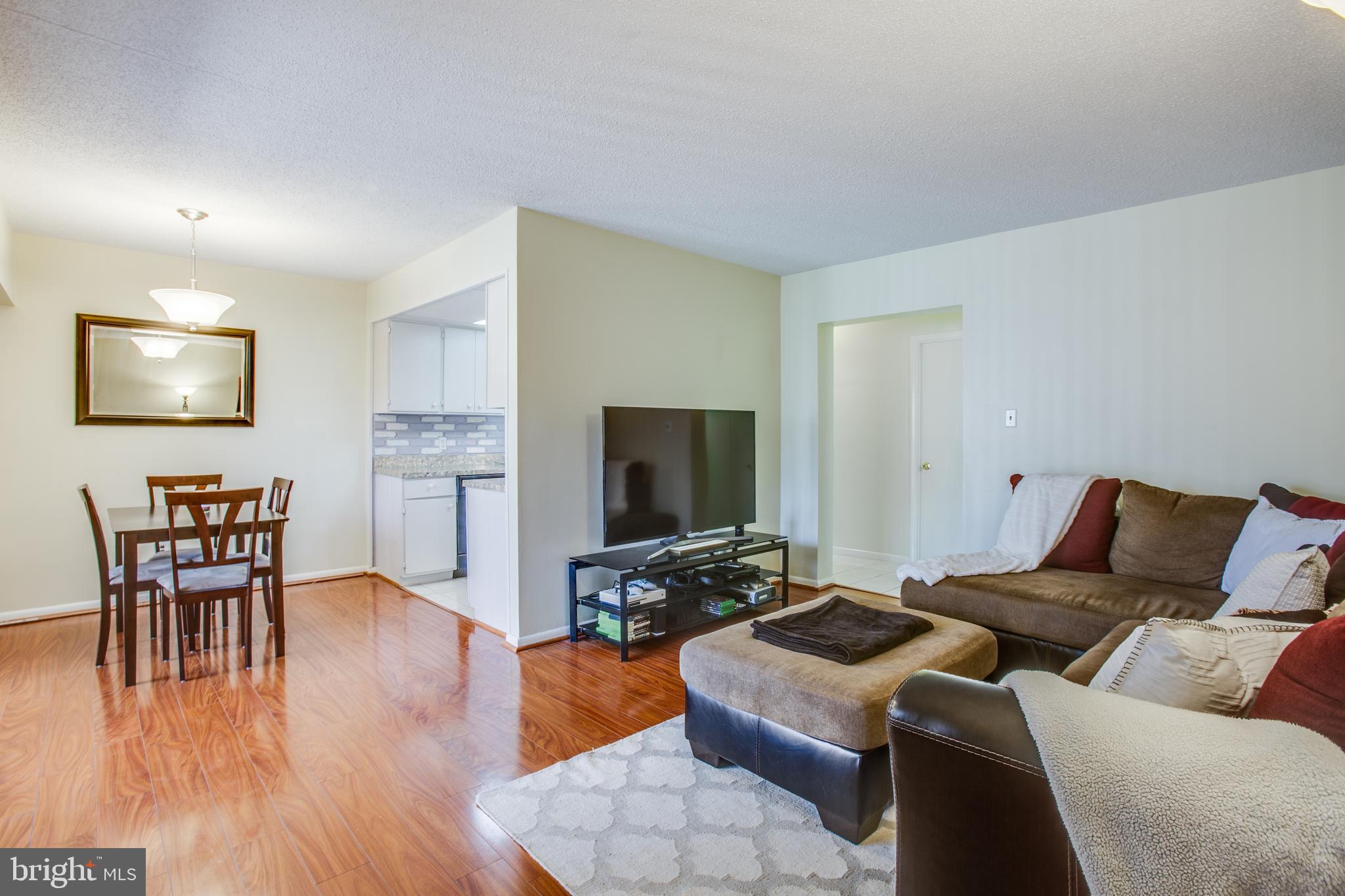 11623 Stoneview Square, Unit 11C Reston, VA 20191 - Photo 28 of 28 Open floor plan. View of dining and living areas