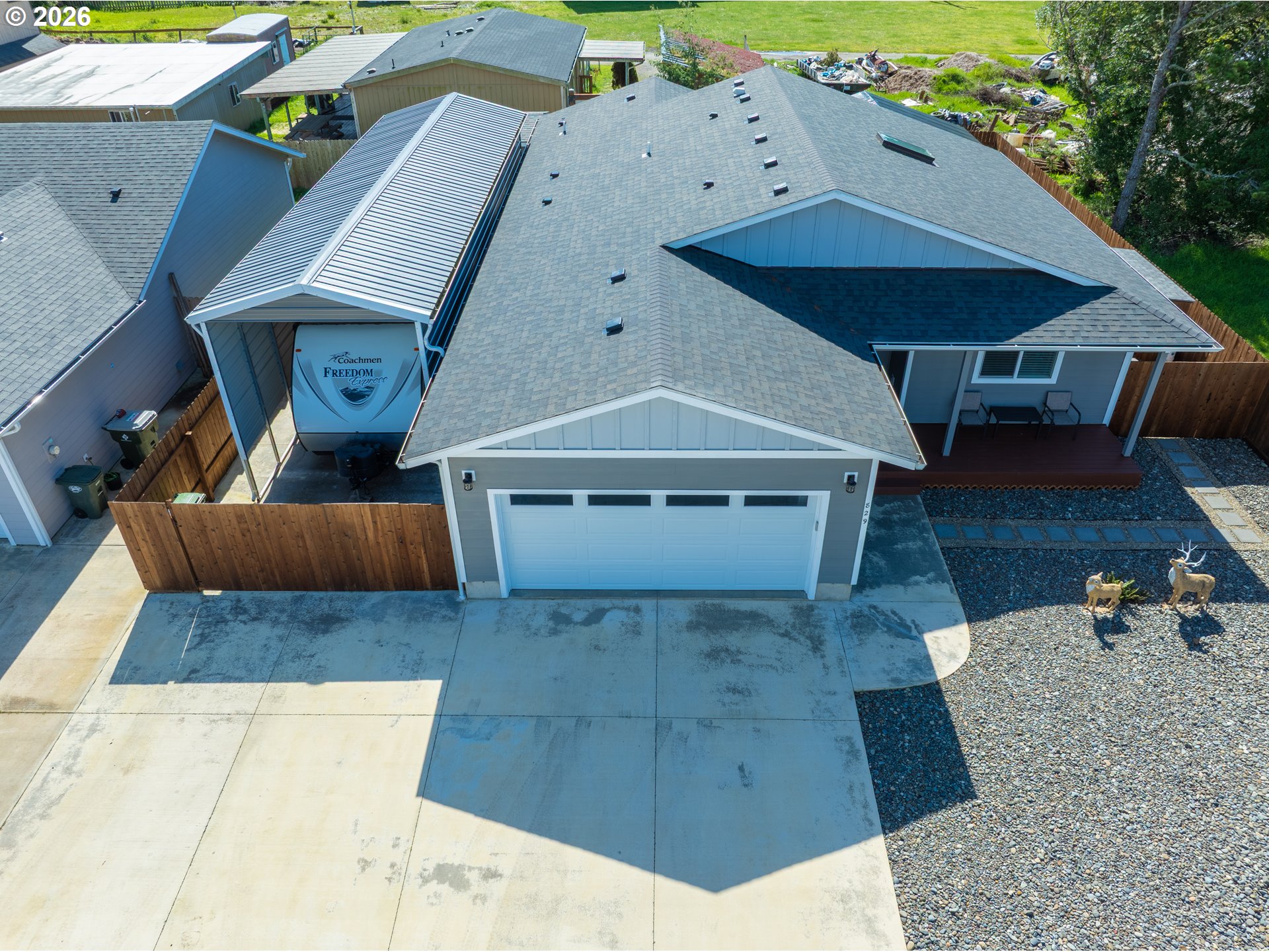 829 Jacobson Way Lakeside, OR 97449 - Photo 1 of 39 an aerial view of a house with roof deck