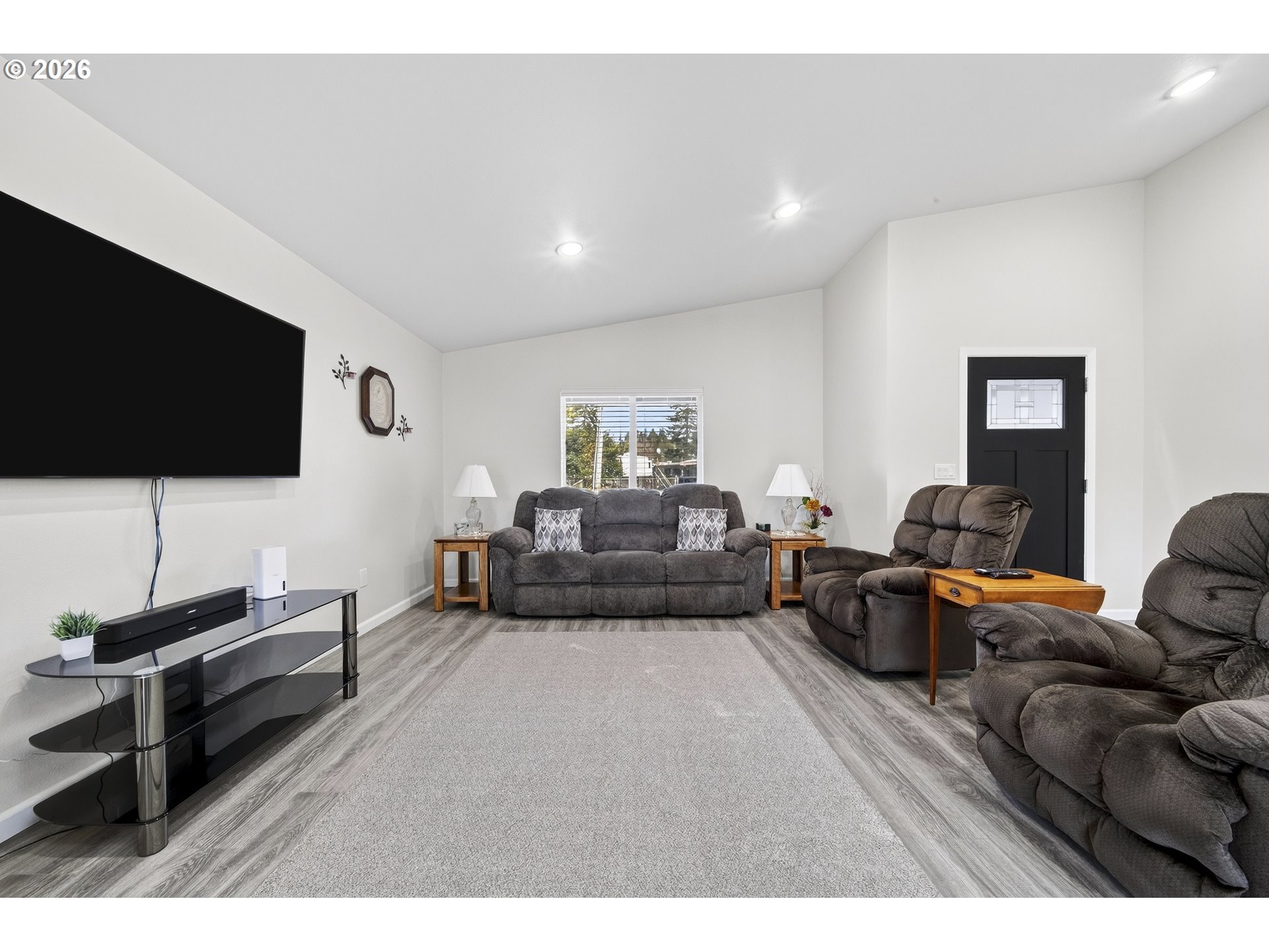 829 Jacobson Way Lakeside, OR 97449 - Photo 11 of 39 a living room with furniture and a flat screen tv