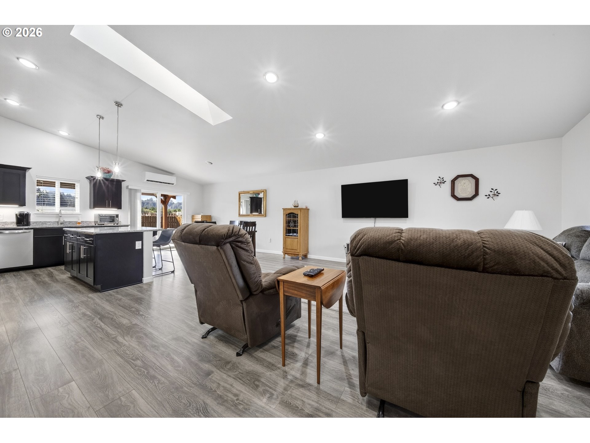 829 Jacobson Way Lakeside, OR 97449 - Photo 12 of 39 a living room with furniture and a flat screen tv