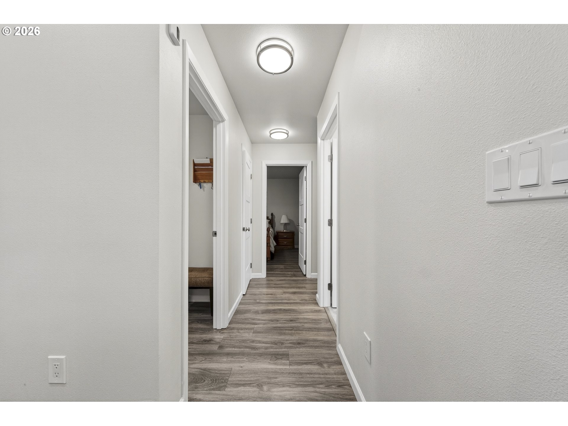 829 Jacobson Way Lakeside, OR 97449 - Photo 13 of 39 a view of a hallway with wooden floor