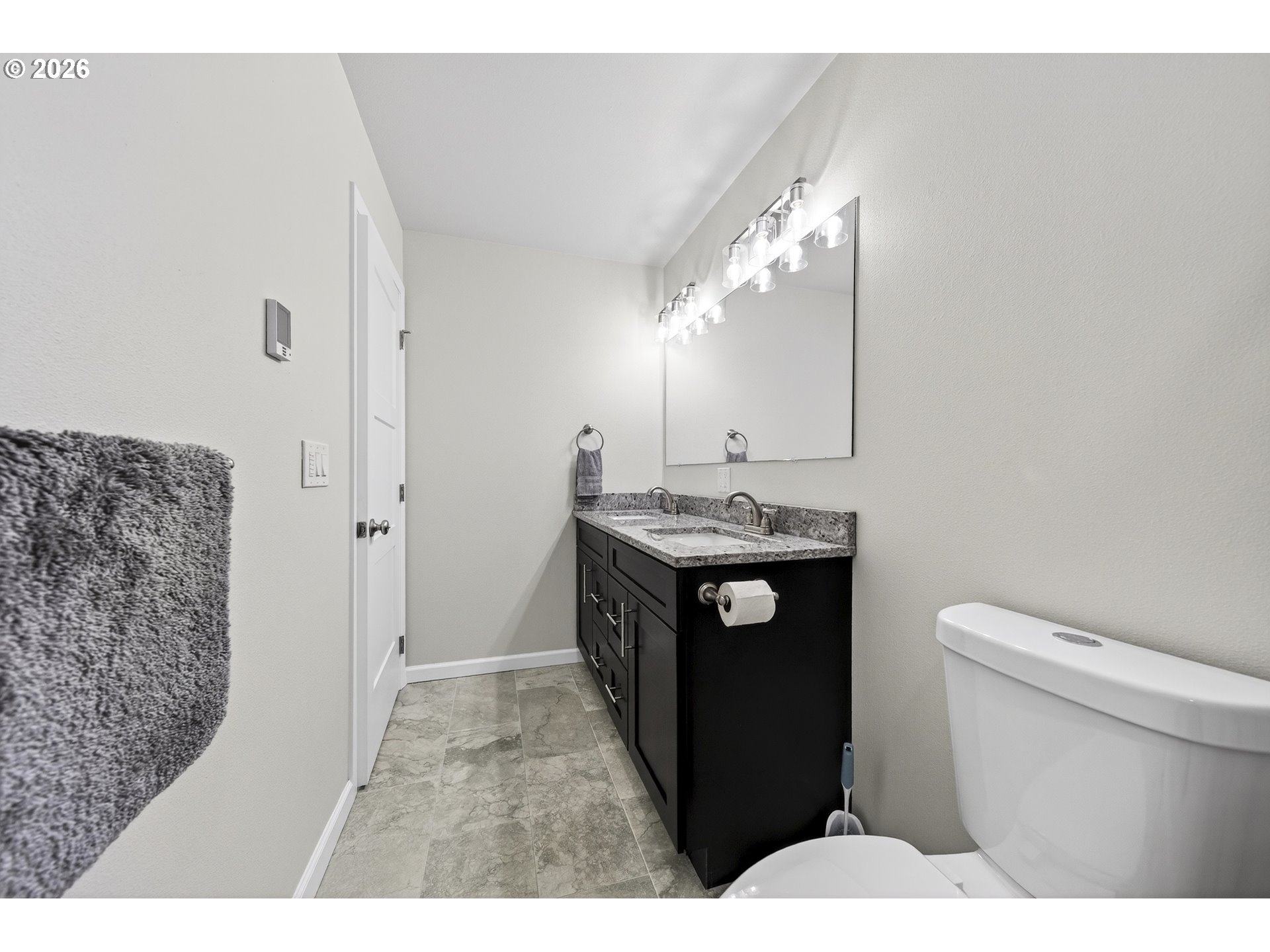 829 Jacobson Way Lakeside, OR 97449 - Photo 20 of 39 a bathroom with a sink a toilet and a mirror