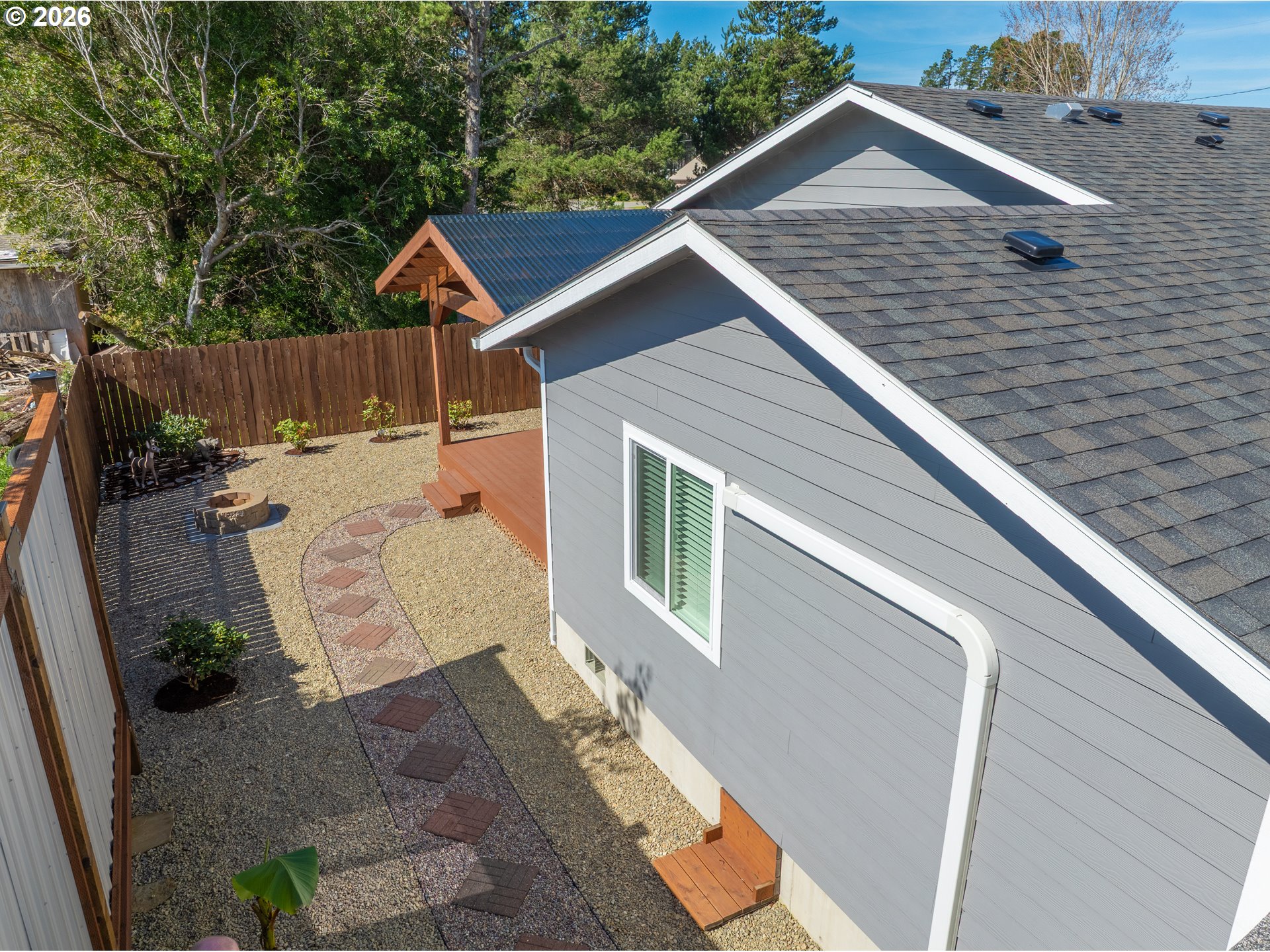829 Jacobson Way Lakeside, OR 97449 - Photo 27 of 39 a view of a house with backyard and sitting area