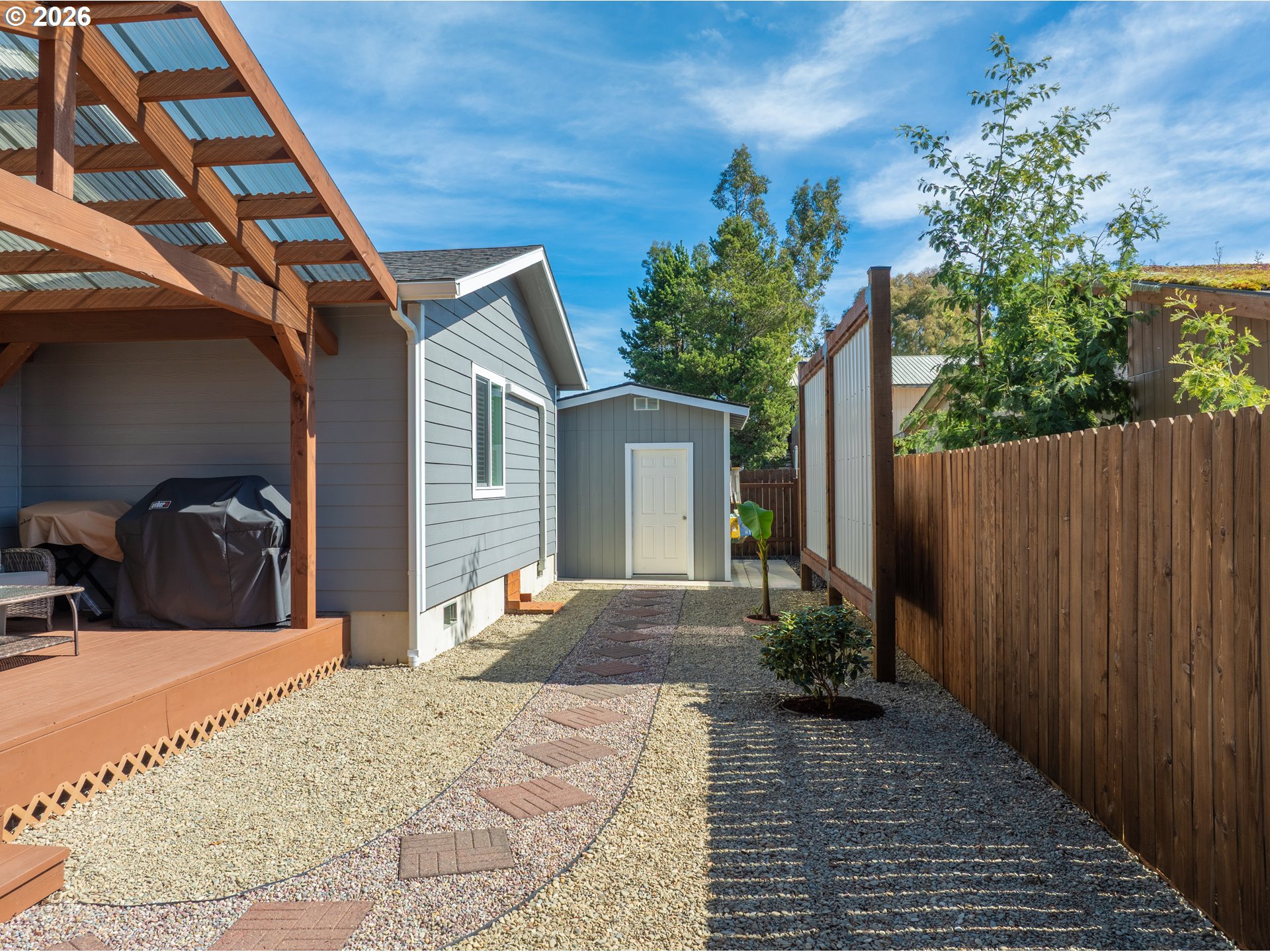 829 Jacobson Way Lakeside, OR 97449 - Photo 28 of 39 a view of a backyard with a patio
