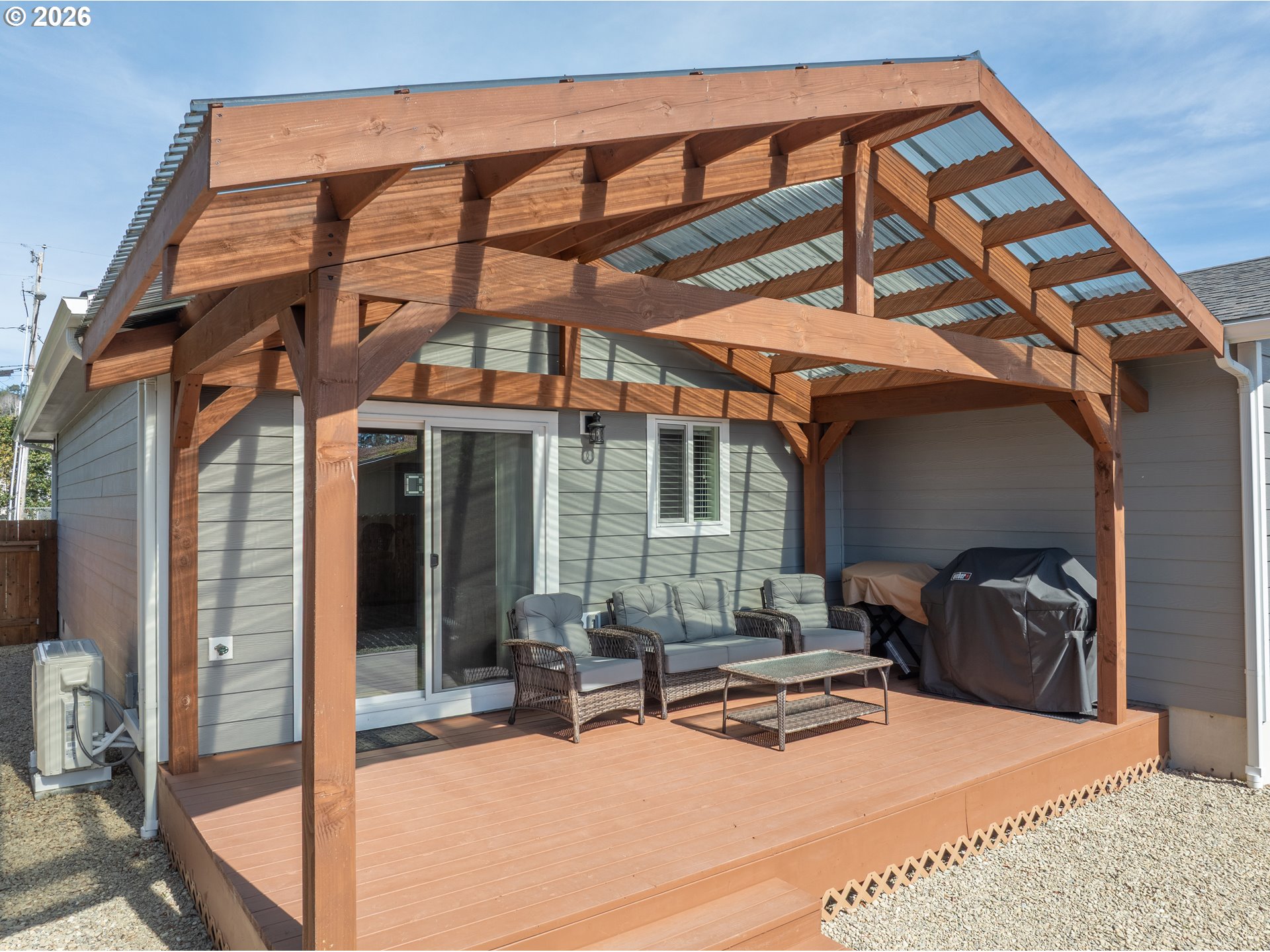 829 Jacobson Way Lakeside, OR 97449 - Photo 32 of 39 a view of a chairs and table in the patio