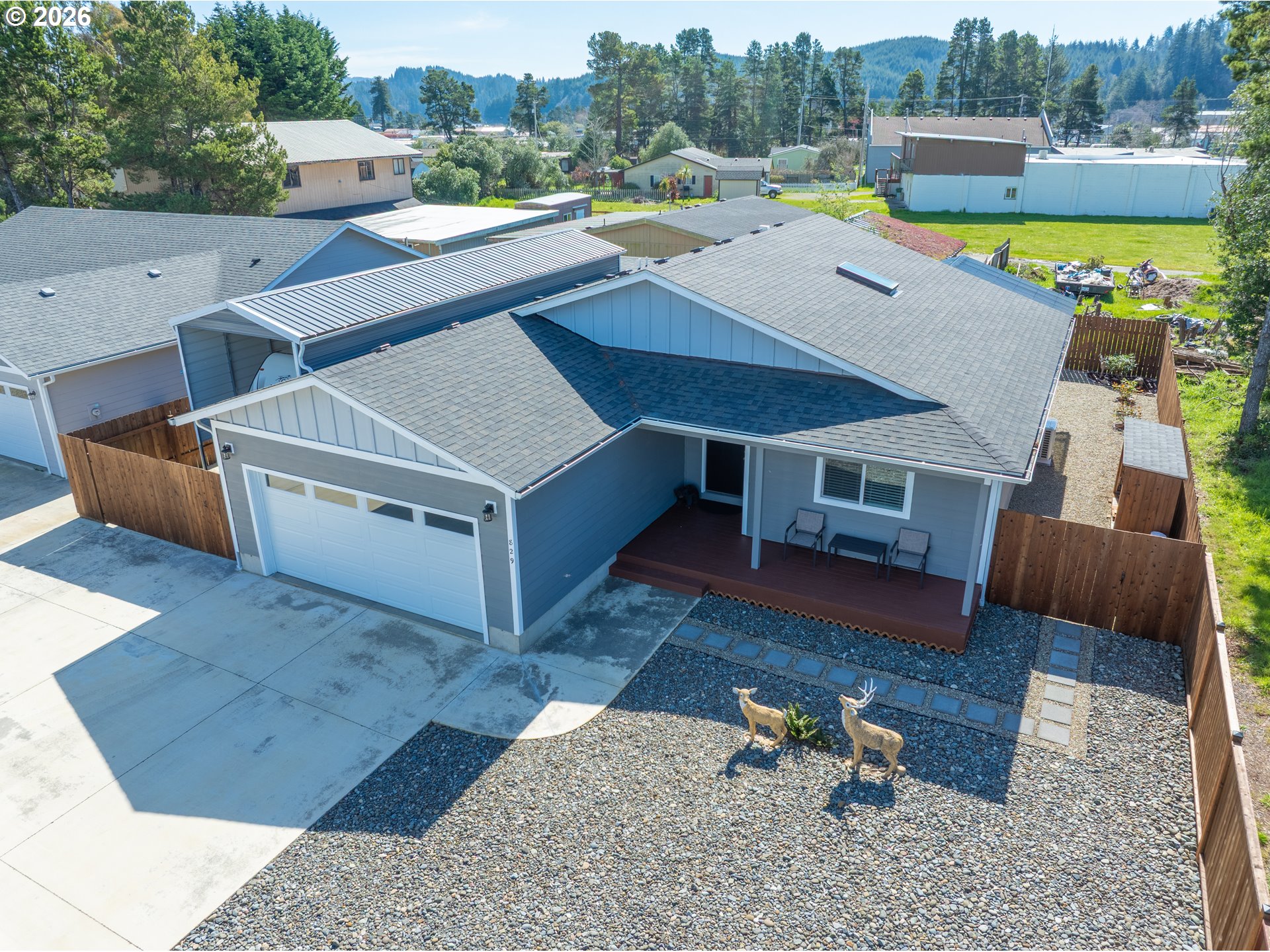 829 Jacobson Way Lakeside, OR 97449 - Photo 36 of 39 an aerial view of a house with pool and a yard