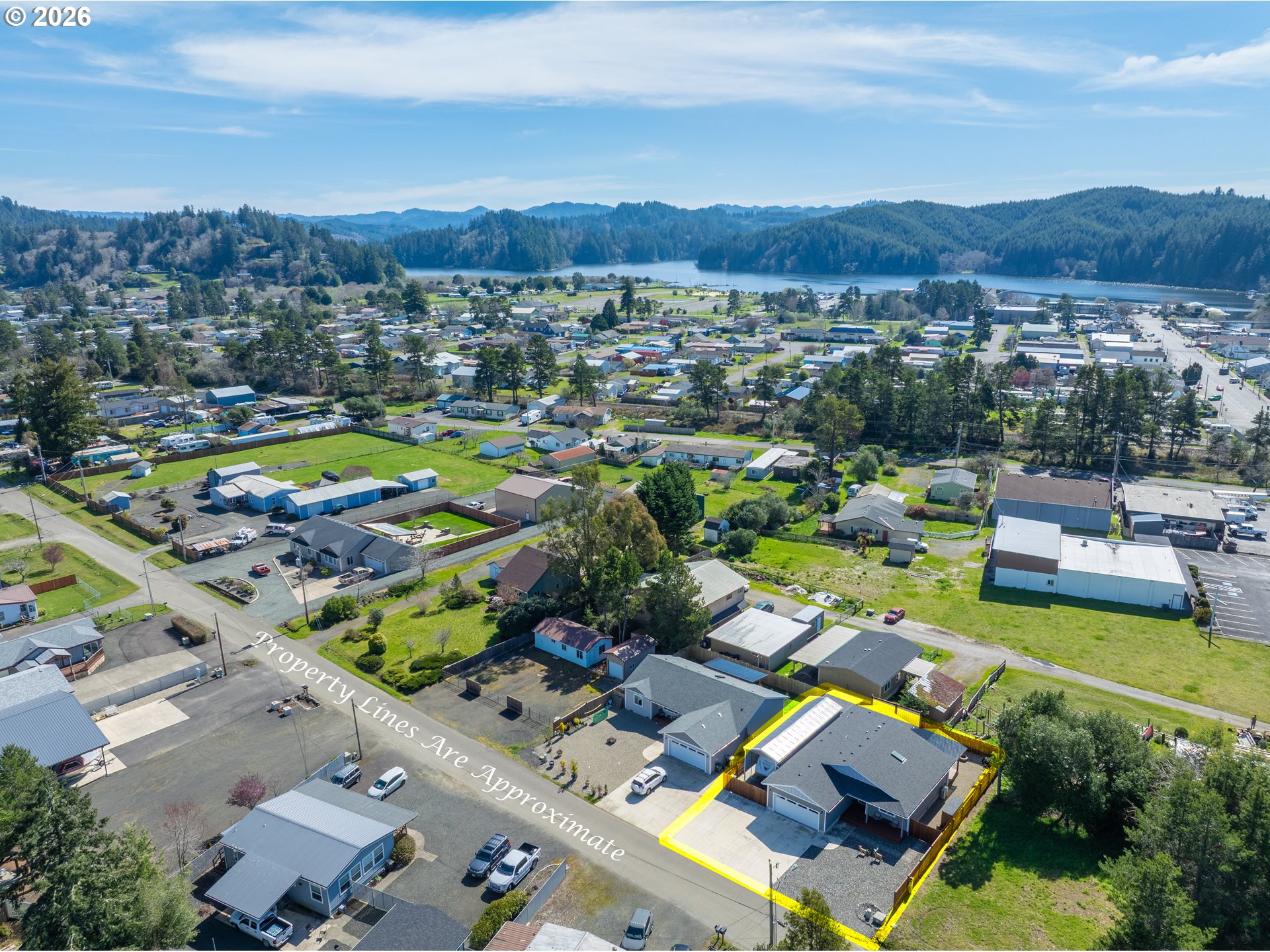 829 Jacobson Way Lakeside, OR 97449 - Photo 38 of 39 a view of a city with lake