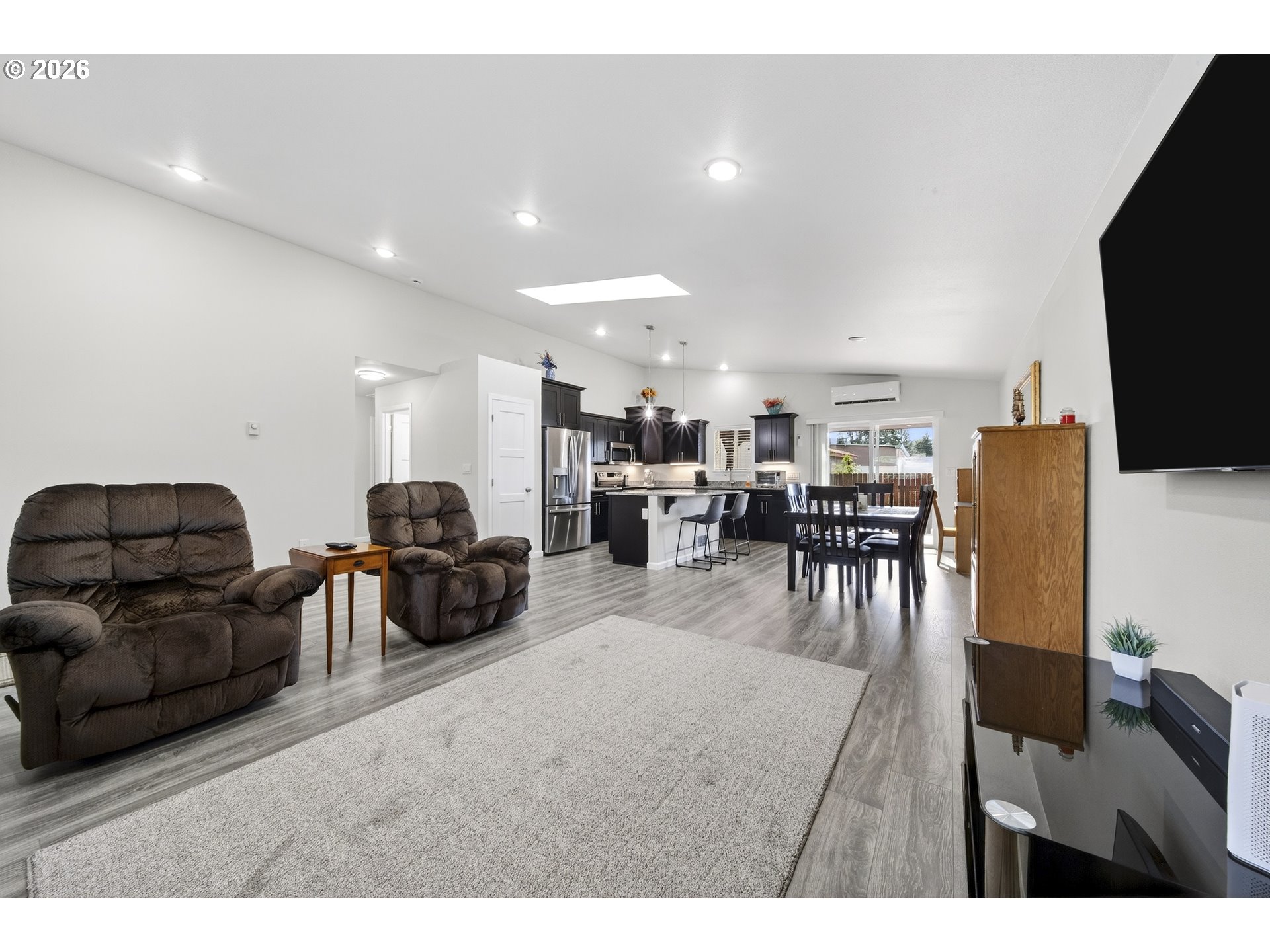 829 Jacobson Way Lakeside, OR 97449 - Photo 10 of 39 a living room with furniture and a flat screen tv