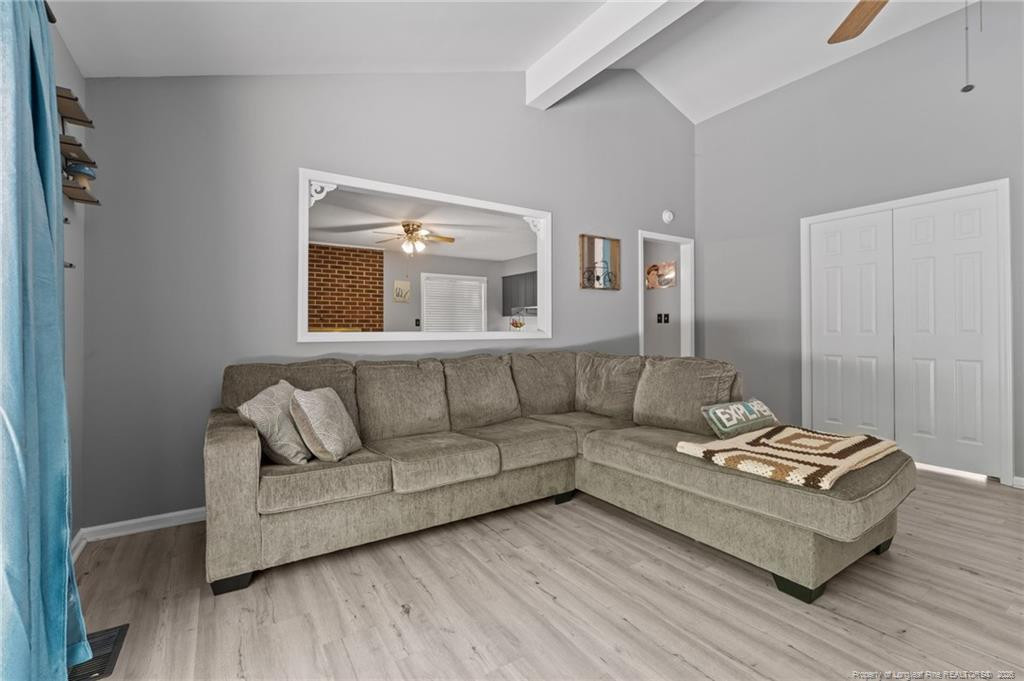129 Overlook Road Cameron, NC 28326 - Photo 15 of 44 a living room with furniture and wooden floor
