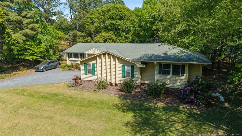 129 Overlook Road Cameron, NC 28326 - Photo 6 of 44 a front view of house with yard and trees around
