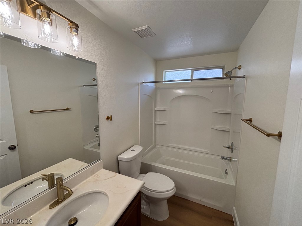 4900 Naff Ridge Drive Las Vegas, NV 89131 - Photo 16 of 21 A well-appointed bathroom with a classic tub and shower combination, complemented by a modern vanity.