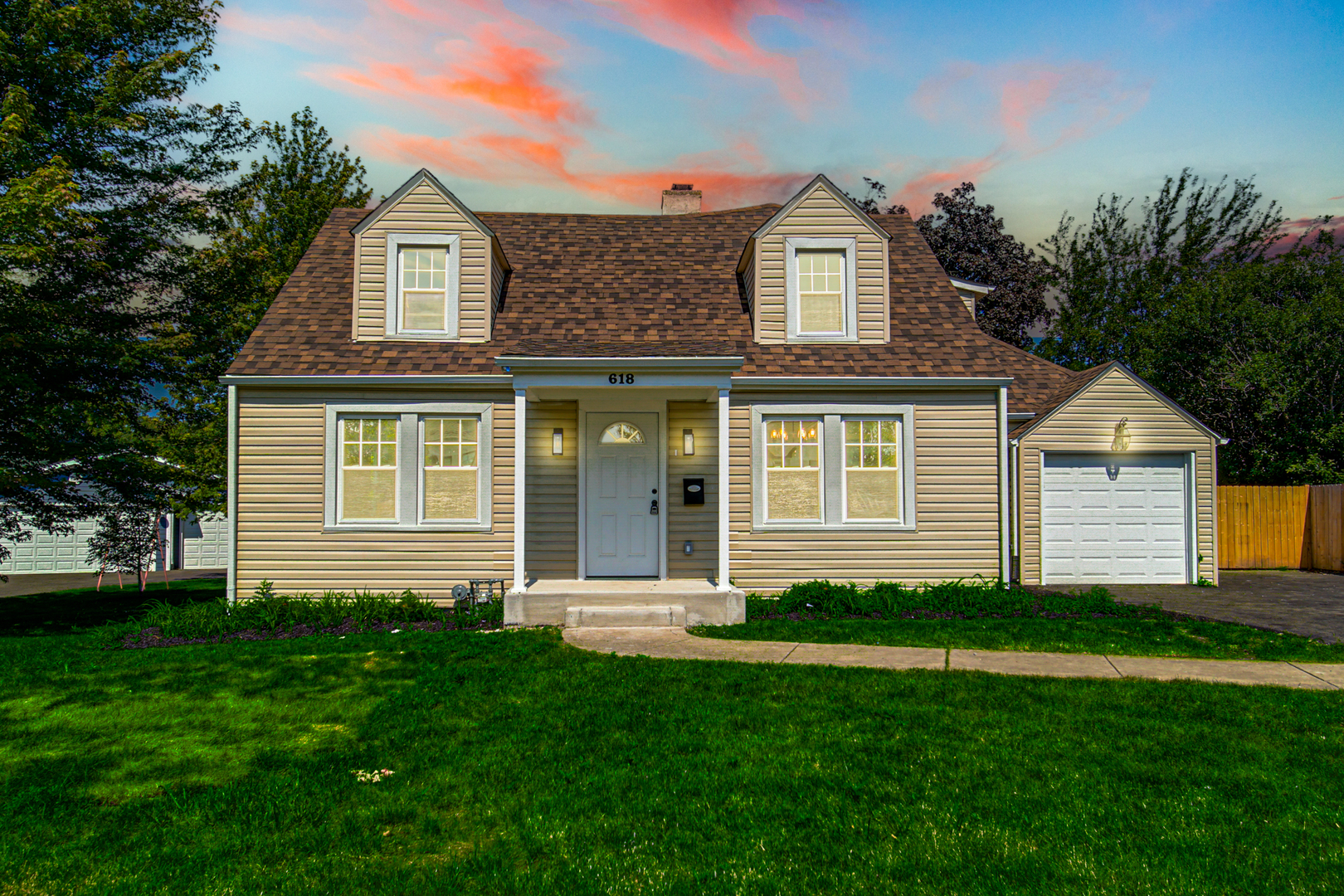 618 Revere Road Glenview, IL 60025 - Photo 1 of 22 a front view of a house with a yard