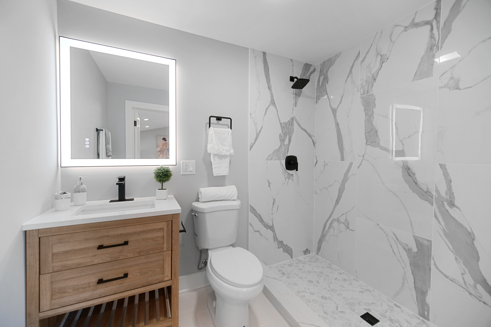 618 Revere Road Glenview, IL 60025 - Photo 13 of 22 a bathroom with a sink toilet vanity and shower