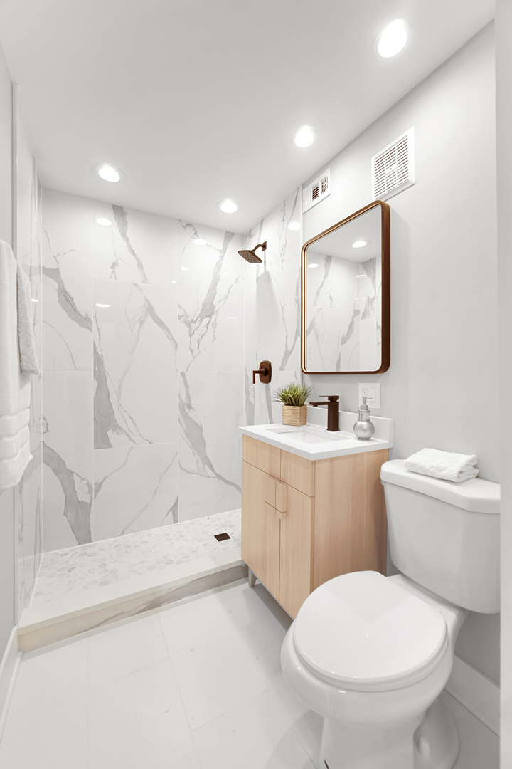 618 Revere Road Glenview, IL 60025 - Photo 19 of 22 a bathroom with a toilet sink and mirror