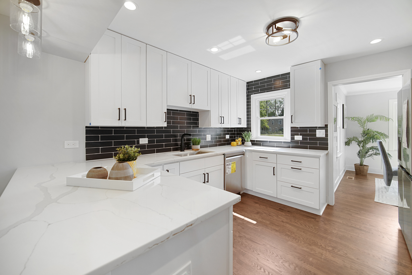 618 Revere Road Glenview, IL 60025 - Photo 8 of 22 a kitchen that has a lot of white cabinets and stainless steel appliances