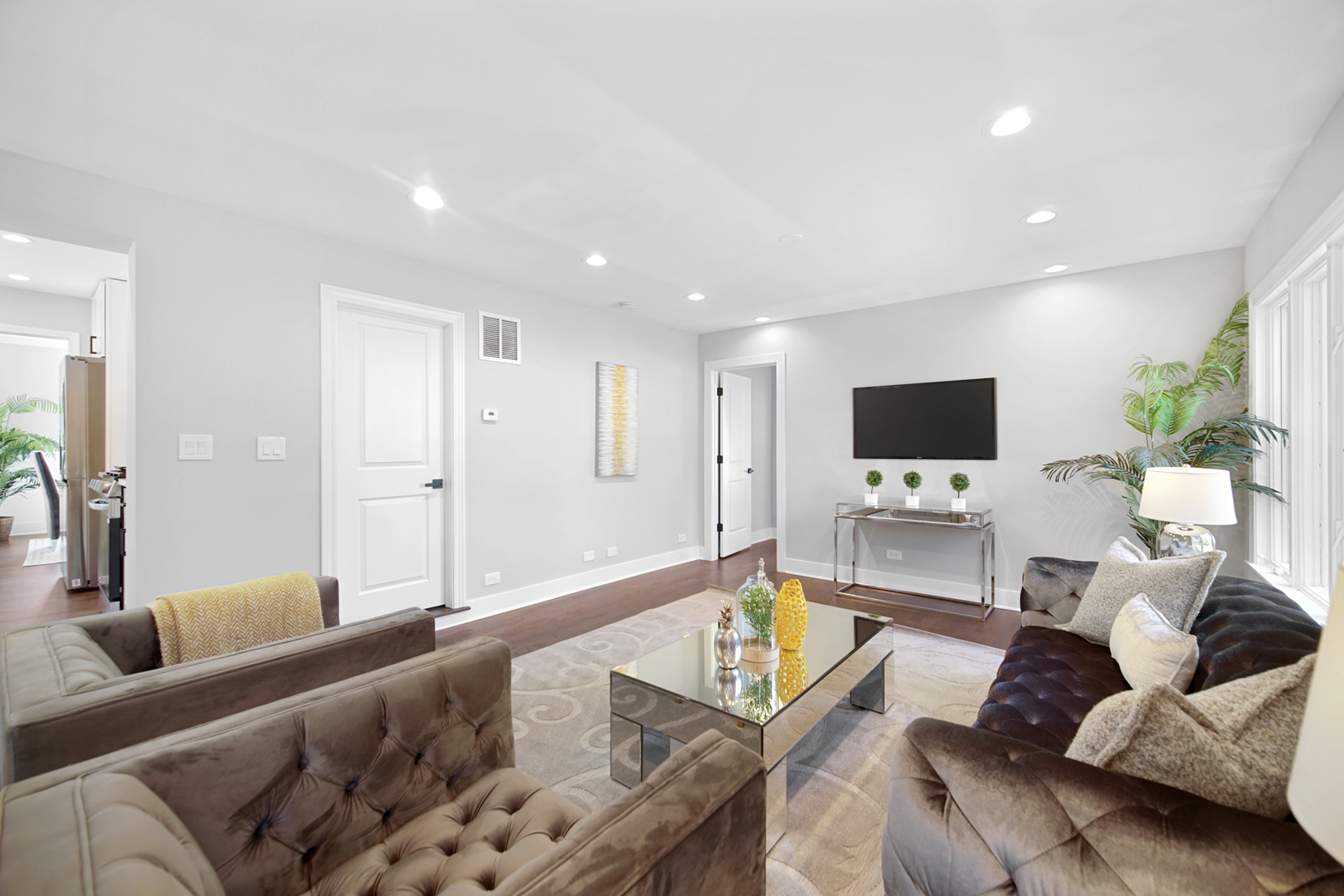 618 Revere Road Glenview, IL 60025 - Photo 9 of 22 a living room with furniture and a flat screen tv